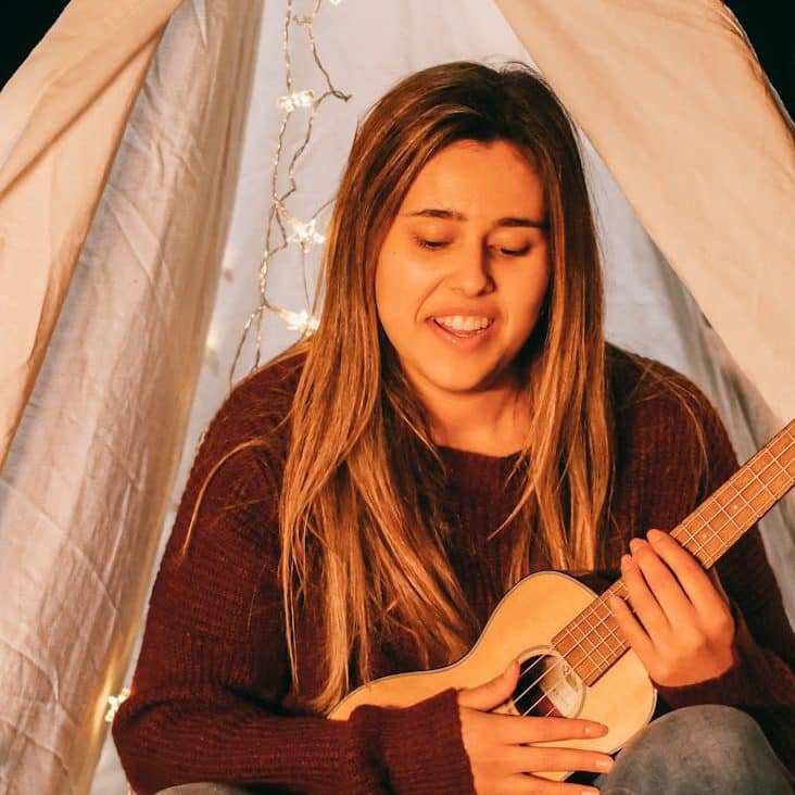 woman playing ukulele